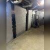 Installed CarbonArmor straps discreetly stabilize walls while maintaining a clean, finished appearance in the basement.