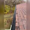 Following the debris removal, this after photo shows the successful installation of RainDrop Gutter Guards on the Andalusia, IL home. The guards provide a clear, permanent path for water runoff, completely eliminating the clogs and overflow seen previously. By directing rainwater safely away from...