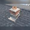 Brand-new chimney flashing was installed to create a fully watertight seal at the chimney base. A major improvement from what was there before!