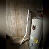 Exterior pipe installed for sub-slab depressurization, carefully positioned to optimize radon reduction.
