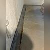 The HomeSpec team installed an interior drainage system to guide unwanted water to the sump pump.