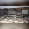 This crawl space is saturated with moisture and cluttered with debris, creating conditions that encourage mold growth, structural damage, and poor indoor air quality-making cleanup and encapsulation essential.