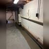 The finished WaterGuard perimeter drainage system sits discreetly along the floor's edge, keeping the basement dry without affecting usable space.