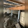 This crawl space now has reinforced support, thanks to the installed SmartJacks working beneath the floor joists.