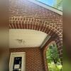 The story begins with a major warning sign at this home in King, NC: a large vertical crack forming through the brick arch above the porch. This type of cracking indicates that the porch structure is shifting and no longer being evenly supported by the soil beneath it. As the ground settles or...