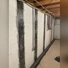 CarbonArmor installation stabilizes this basement wall and helps prevent future movement.