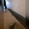WaterGuard was installed around the perimeter of the basement to direct any seeping water to the sump pump for removal.