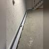 This photo captures the process of installing WaterGuard to create a permanent waterproofing solution.