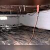 This crawl space was anything but a healthy or dry environment. It was filled with dirt and had moisture problems.