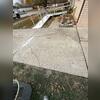 HomeSpec injected PolyLevel beneath the concrete to lift the slab, making it even.