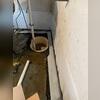 The sump pump system is being installed to provide reliable water removal from the basement.