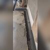 This photo shows WaterGuard being installed to redirect water safely to the sump pump system.