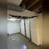 Our crew are expert multitaskers! They install the CleanSpace wall vapor barrier, PowerBrace beams, and WaterGuard drainage pipe in succession to ensure a seamless final product.