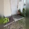 The concrete slab at this home's entry was significantly unlevel, creating a hazardous gap between the ground and the doorway.