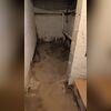 This image shows before our team installed a waterproofing system. You can see how water is affecting the area, growing mold, and creating a space that makes it hard to store items. In the bottom right corner you can see that the box stored down here has suffered damage due to water in the...