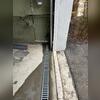 TrenchDrain was installed by the entrances to stop moisture in its tracks before it spreads through the rest of the basement.