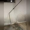 This was just one of the large cracks that Jim and Cheryl had been dealing with. The constant water seepage had caused stains and damage to the walls and floors in their basement.