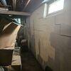 The large stair-stepping and horizontal cracks in the basement wall are the most visible signs that a larger structural issue was at hand. If you also looked at them at a right angle, you could start to see the inward movement they were facing.