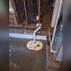The HomeSpec Crew installed a SuperSump sump pump to add protection against the residing water in the garage.