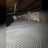 Drainage matting helps channel moisture away from the crawl space floor.
