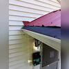 Upgrading the gutters and downspout extensions helped protect this home from further water damage.