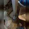 The SmartJack&reg; base assembly is positioned securely on the prepared footing, after which the adjustable support post is installed and fastened to the base.