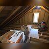 This photo was taken by our energy consultant and shows how empty the attic is of any insulation. This caused high heating bills and an uncomfortably cold home.