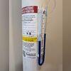 U-tube manometer mounted on the system to visibly confirm proper airflow and active depressurization.