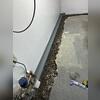 WaterGuard is placed below the footer to collect wall and floor seepage before damage can occur.