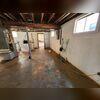 This photo shows the state of the basement before Fortress Waterproofing repairs.