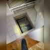 The only way into this 1-foot-tall crawl space was through a small hatch in a closet!