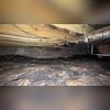 The state of the crawl space that led to sagging floors.