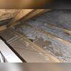 This photo was taken during the free estimate and shows that the fiberglass was not high enough in R-value or evenly spread to protect the home properly.