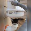 High-performance radon fan installed to continuously draw soil gases from beneath the slab and safely vent them above the roofline.