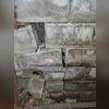 Bricks were falling apart due to a shifting foundation