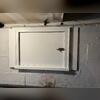 The new crawl space door our team also installed.