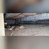 This crawl space shows damp floors and insulation in need of replacement.
