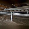 Here you can see our SmartJack system with a supplemental beam installed to stabilize the floors above.