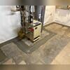 TrenchDrain was installed around the utilities in the basement to protect them by catching excess and surface water. It is connected to the WaterGuard drainage system.