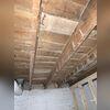 Sagging beams in this 100 year old were causing the floors to sink and creak.