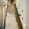Once everything was installed, the last step was to seal it in place with a fresh layer of concrete. After the concrete dries and sets, Ryan can finish his basement without fear of seepage!