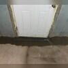 TrenchDrain is installed in front of the basement door that leads outside to catch excess and surface water. It is connected to the WaterGuard drainage system.