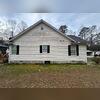 Before we washed the siding, it was covered in black grime that was making the home look unsightly.