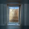 This is what the closed window looks like from the inside. The natural stone looking well has built in stairs for easy access in case of emergency.