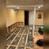 Once the flooring was removed, the full extent of water intrusion in the finished basement became evident. Moisture infiltration had led to the accumulation of water, dirt, and mold beneath the subfloor and within the lower sections of the drywall, necessitating their removal.