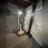 TripleSafe sump pump installed and protecting the basement from water intrusion. With primary, secondary, and backup pumps, it ensures complete flood protection.