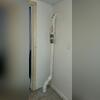 This home has a walkout basement. The radon extraction point located in the laundry room and exited the CMU block wall. The pipe routed beneath the overhang of the bump out.