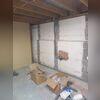 Prepping the walls by sanding, and then filling in cracks with epoxy.
