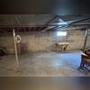 The walls of this basement had been leaking for many years, creating a damp basement environment and ruining stored belongings.