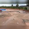 Technicians inject PolyLevel beneath the concrete to lift and stabilize the pool deck, filling voids and restoring structural support.